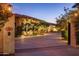 Elegant home with gated entry and beautifully landscaped grounds at 66 Biltmore Est, Phoenix, AZ 85016