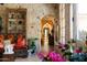 Stone hallway with arched entryways and unique decor at 66 Biltmore Est, Phoenix, AZ 85016
