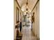 A long hallway with arched entryways and unique lighting at 66 Biltmore Est, Phoenix, AZ 85016