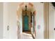 Elegant hallway with arched entryways and unique architectural details at 66 Biltmore Est, Phoenix, AZ 85016