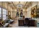 Elegant home office features built-in shelving and a large desk at 66 Biltmore Est, Phoenix, AZ 85016