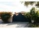 Private gated entrance to a luxurious Mediterranean-style home at 66 Biltmore Est, Phoenix, AZ 85016