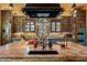 Gourmet kitchen with custom cabinetry and high-end appliances at 66 Biltmore Est, Phoenix, AZ 85016