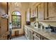 Bright laundry room with ample counter and cabinet space at 66 Biltmore Est, Phoenix, AZ 85016