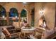 Outdoor patio with fireplace and comfortable seating area at 66 Biltmore Est, Phoenix, AZ 85016