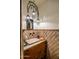 Powder room with ornate light fixture and unique tile at 66 Biltmore Est, Phoenix, AZ 85016