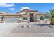 Charming single-story home featuring desert landscaping, a two-car garage, and gated entry in a desirable neighborhood at 665 N Wyatt Dr, Chandler, AZ 85226