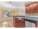 Kitchen with sink, dishwasher, and wood cabinets at 750 E Northern Ave # 1134, Phoenix, AZ 85020