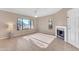 Living room with tile floors, fireplace, and window at 750 E Northern Ave # 1134, Phoenix, AZ 85020