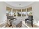 Relaxing sitting area with bay windows, offering abundant natural light and views at 8027 E Juan Tabo Rd, Scottsdale, AZ 85255