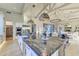 Modern kitchen with a large island, stainless steel appliances, and ample counter space at 8760 E Hackamore Dr, Scottsdale, AZ 85255