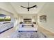 Main bedroom with TV, seating area, and large windows at 8760 E Hackamore Dr, Scottsdale, AZ 85255