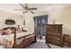 Charming bedroom with a wooden bed frame and a dresser at 9245 N 109Th Dr, Sun City, AZ 85351