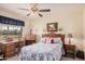 Cozy bedroom with a double bed, desk, and window at 9245 N 109Th Dr, Sun City, AZ 85351