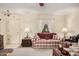 Living room with a plaid couch and charming, country-style decor at 9245 N 109Th Dr, Sun City, AZ 85351