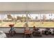 Screened sunroom overlooking a tranquil backyard at 9245 N 109Th Dr, Sun City, AZ 85351