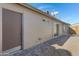 Backyard view showing the exterior of the home and a patio area at 1055 N Recker Rd # 1215, Mesa, AZ 85205