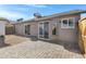 Updated backyard with patio, gravel, and neutral colored brick at 1055 N Recker Rd # 1215, Mesa, AZ 85205