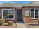 Attractive front door with black wrought iron detail, and brick facade at 1055 N Recker Rd # 1215, Mesa, AZ 85205