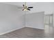 Bright living room with grey vinyl plank flooring and a ceiling fan at 1055 N Recker Rd # 1215, Mesa, AZ 85205