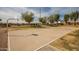 Outdoor basketball court with surrounding trees at 1075 E Chandler Blvd # 120, Chandler, AZ 85225