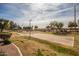 Outdoor basketball court with surrounding trees at 1075 E Chandler Blvd # 120, Chandler, AZ 85225