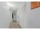 Hallway with built-in storage and wood floors at 1075 E Chandler Blvd # 120, Chandler, AZ 85225