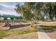 Community playground with play equipment and shaded seating area at 1075 E Chandler Blvd # 120, Chandler, AZ 85225