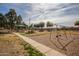 Community playground with swings, play structures, and shaded seating at 1075 E Chandler Blvd # 120, Chandler, AZ 85225