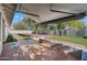 Patio with retractable awning, artificial turf, and red tile at 11209 N 40Th St, Phoenix, AZ 85028