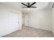 Bright bedroom with ceiling fan and sliding door closet at 11209 N 40Th St, Phoenix, AZ 85028