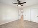 Well-lit bedroom with ceiling fan and door to hallway at 11209 N 40Th St, Phoenix, AZ 85028