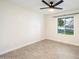 Spacious bedroom with large window and ceiling fan at 11209 N 40Th St, Phoenix, AZ 85028