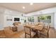 Light and airy dining area with hardwood floors and wood dining table at 11209 N 40Th St, Phoenix, AZ 85028