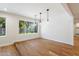 Open concept dining area with hardwood floors and large windows at 11209 N 40Th St, Phoenix, AZ 85028