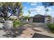 House exterior showcasing landscaping, driveway, and a two-car garage at 11209 N 40Th St, Phoenix, AZ 85028