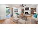 Living room with hardwood floors, fireplace, and built-in shelving at 11209 N 40Th St, Phoenix, AZ 85028