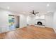 Bright living room with hardwood floors, fireplace, and sliding glass doors at 11209 N 40Th St, Phoenix, AZ 85028