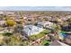 Aerial view of a luxurious property, complete with a putting green and pool at 11243 E Flintlock Dr, Chandler, AZ 85249