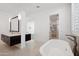 Elegant bathroom with double sinks and a freestanding tub at 11243 E Flintlock Dr, Chandler, AZ 85249