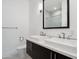 Modern bathroom with double sinks and a large mirror at 11243 E Flintlock Dr, Chandler, AZ 85249