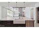 Kitchen island with farmhouse sink and white quartz countertop at 11243 E Flintlock Dr, Chandler, AZ 85249