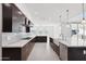 Modern kitchen with farmhouse sink and stainless steel appliances at 11243 E Flintlock Dr, Chandler, AZ 85249