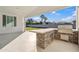 Outdoor kitchen with built-in grill and countertop at 11243 E Flintlock Dr, Chandler, AZ 85249