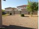 Landscaped backyard with gravel and small shrubs at 11432 E Quicksilver Ave, Mesa, AZ 85212