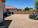 Backyard with gravel, a few plants, and trash cans at 11432 E Quicksilver Ave, Mesa, AZ 85212