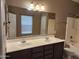 Double sink bathroom with large mirror and bathtub at 11432 E Quicksilver Ave, Mesa, AZ 85212