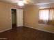 Bedroom with wood-look tile floor and ceiling fan at 11432 E Quicksilver Ave, Mesa, AZ 85212