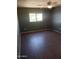 Bedroom with wood-look tile floor and ceiling fan at 11432 E Quicksilver Ave, Mesa, AZ 85212