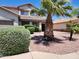 Two-story house with desert landscaping and a large palm tree in the front yard at 11432 E Quicksilver Ave, Mesa, AZ 85212